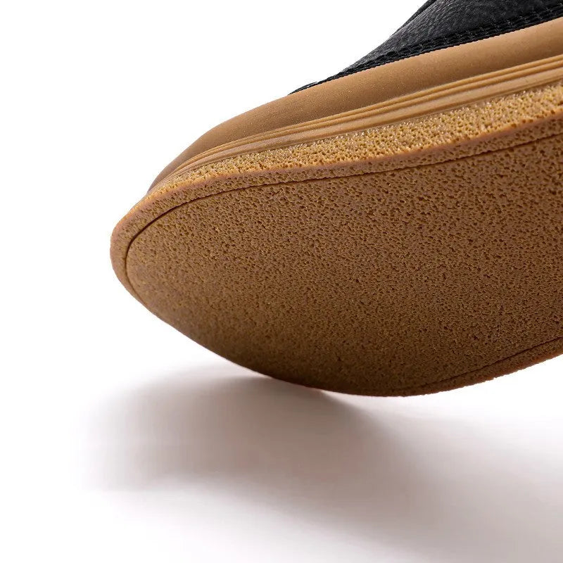 Men's black leather casual lace-up shoes with a round toe and flat rubber sole.