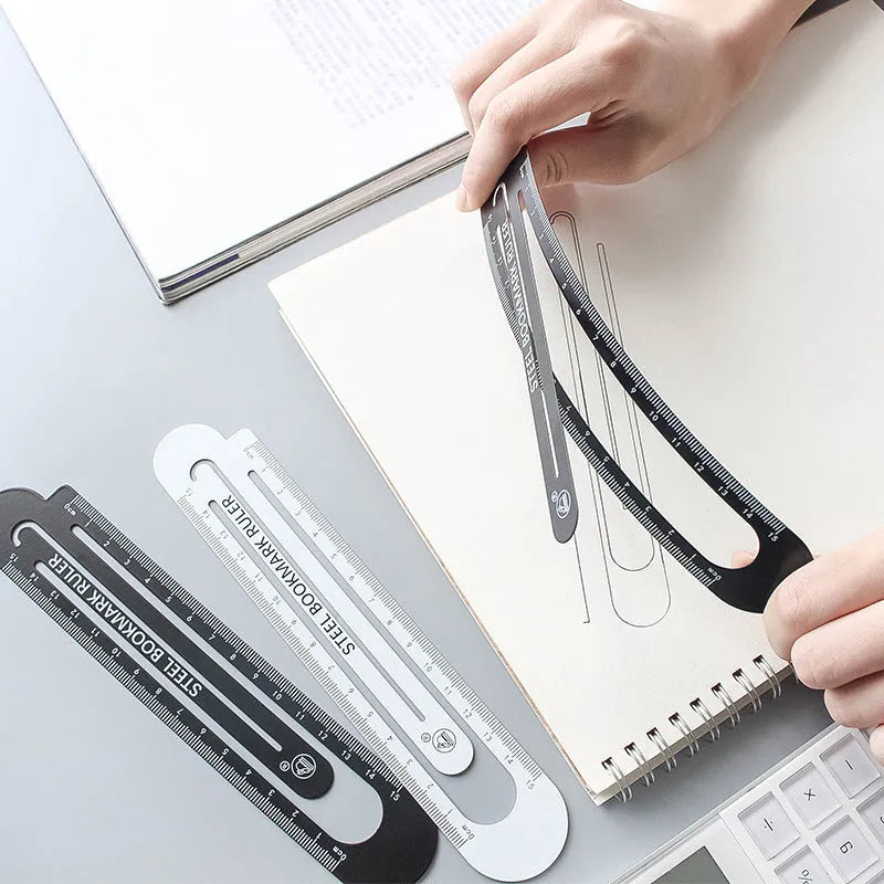 Black and white two-sided ruler 12cm long on white surface