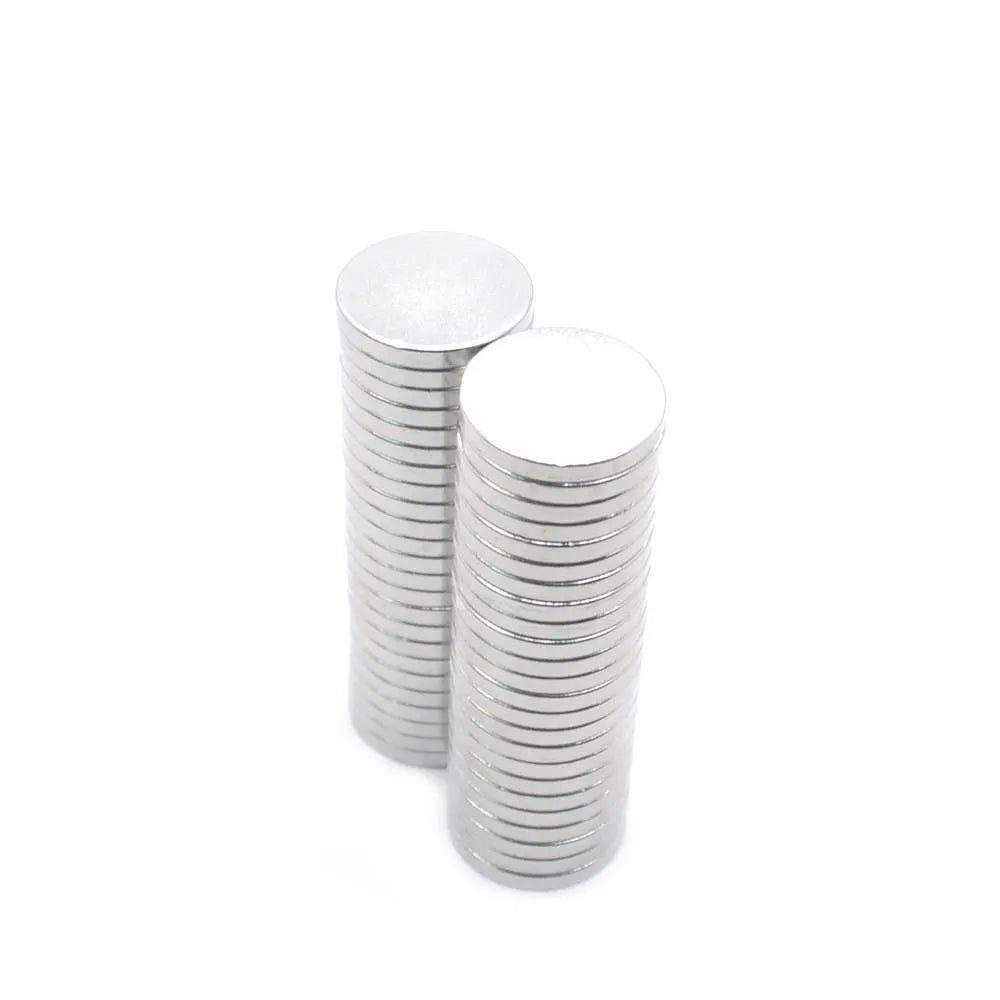 Silver NdFeB disc magnet 14mm diameter 2mm thickness on white background