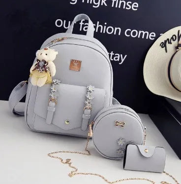 Black pu leather 3-piece bag set showing backpack, crossbody shoulder bag, and card purse.