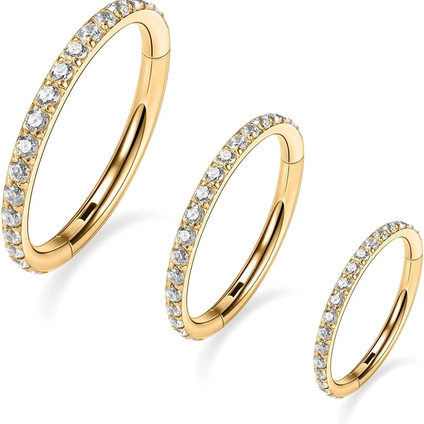 A round, seamless nose ring made of stainless steel, shown in various electroplated colour finishes including gold, rose gold, and black.