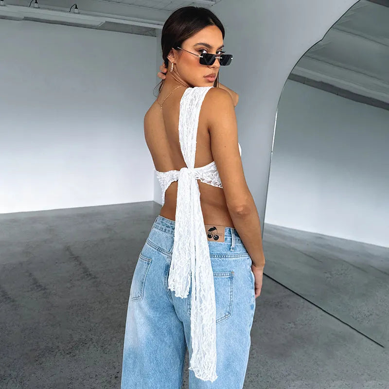 Women's sleeveless lace backless vest with asymmetrical neckline in solid colour.