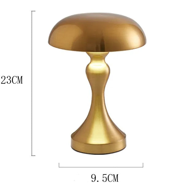 Metallic-finish touch-control LED desk lamp showing three colour light modes on a wooden desk.