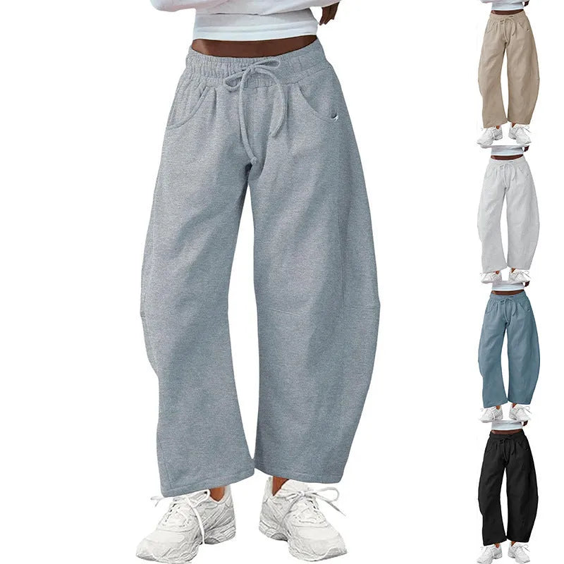 Loose-fit cropped sweatpants with drawstring waistband and side pockets in multiple colour options