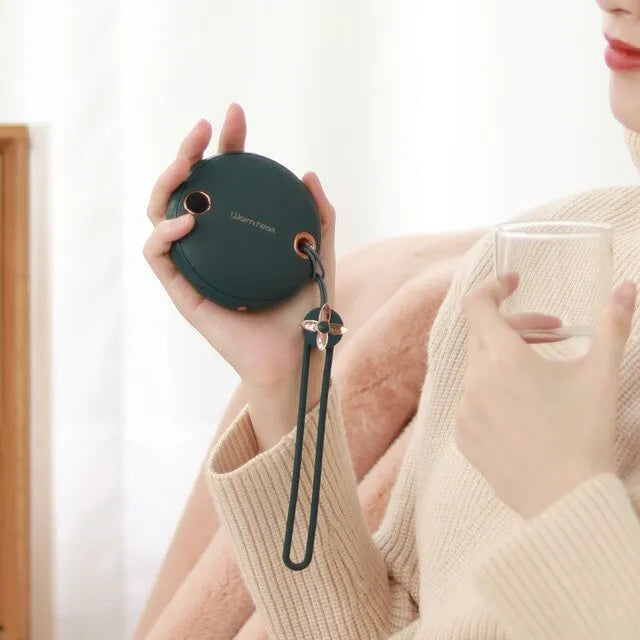Green portable power bank with hand warmer function showing digital display and Type-C port