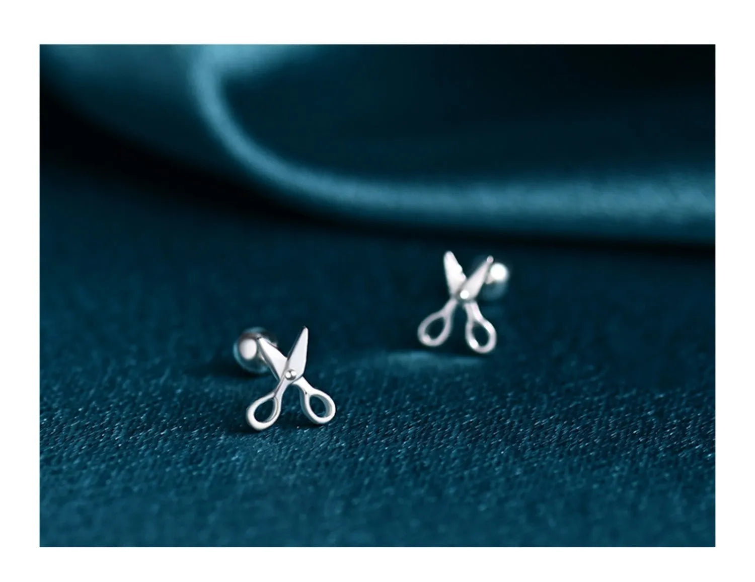 A pair of pure silver ear nails with a miniature scissors screw fastening mechanism.