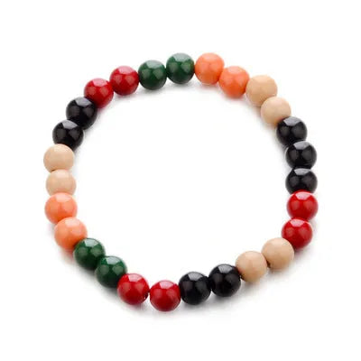 Natural stone bead bracelet with lava stones on a wrist, showing ethnic style and unisex design.
