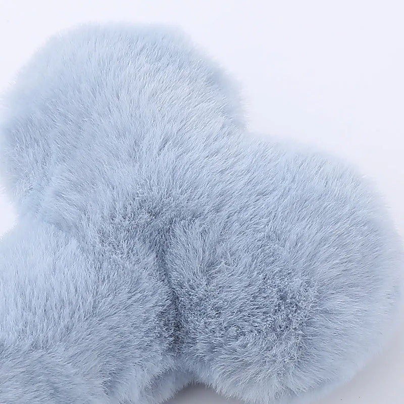 Blue plush bone-shaped dog toy with a squeaker for interactive pet play.