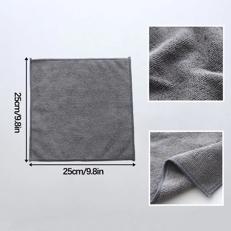 Grey square microfiber kitchen cleaning cloth for oil and grime on pots and bowls.