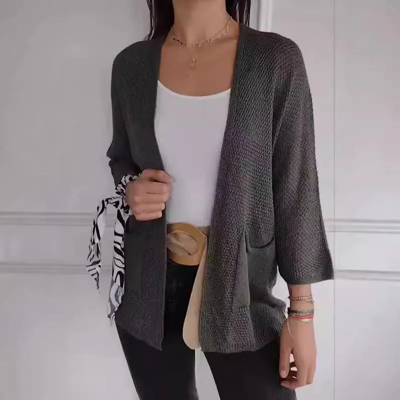 Women's waffle-textured cardigan coat in army green with nine-quarter sleeves and pockets.
