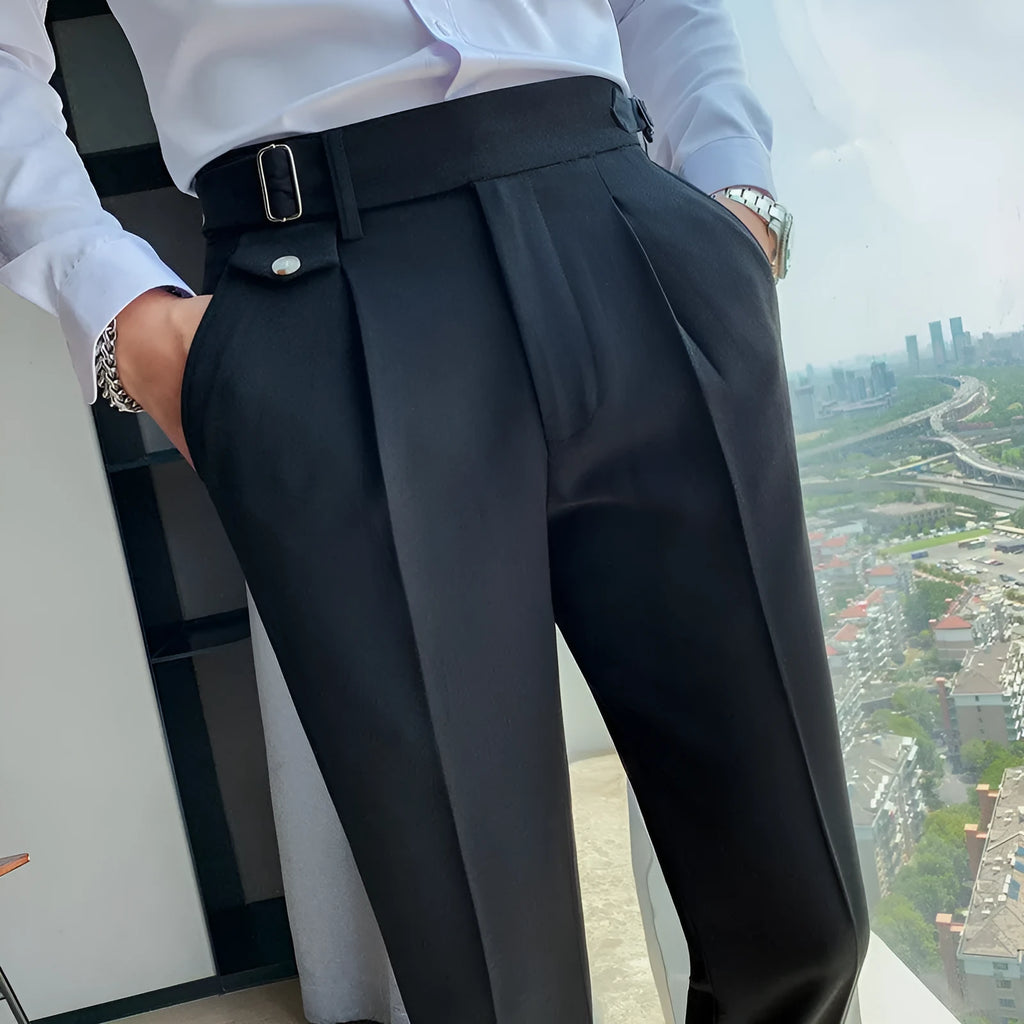 Men's straight-leg casual trousers in solid colours including black and grey, laid flat.