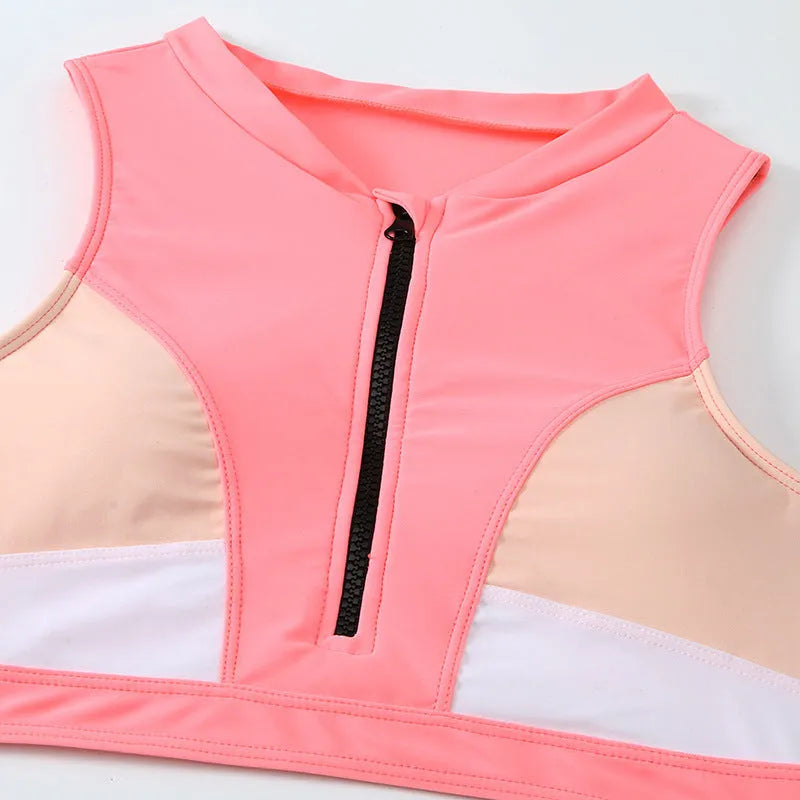 Pink high waist split bikini swimsuit on a mannequin, showing the briefs style and solid colour.