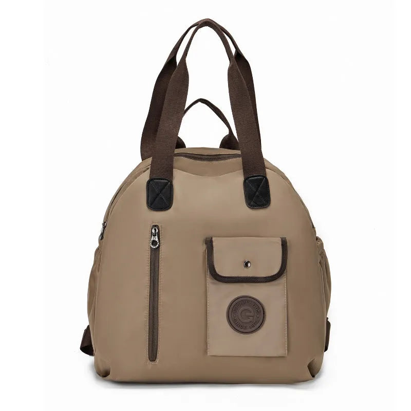 Women's outdoor backpack in black colour showing sandwich pocket design and large main compartment