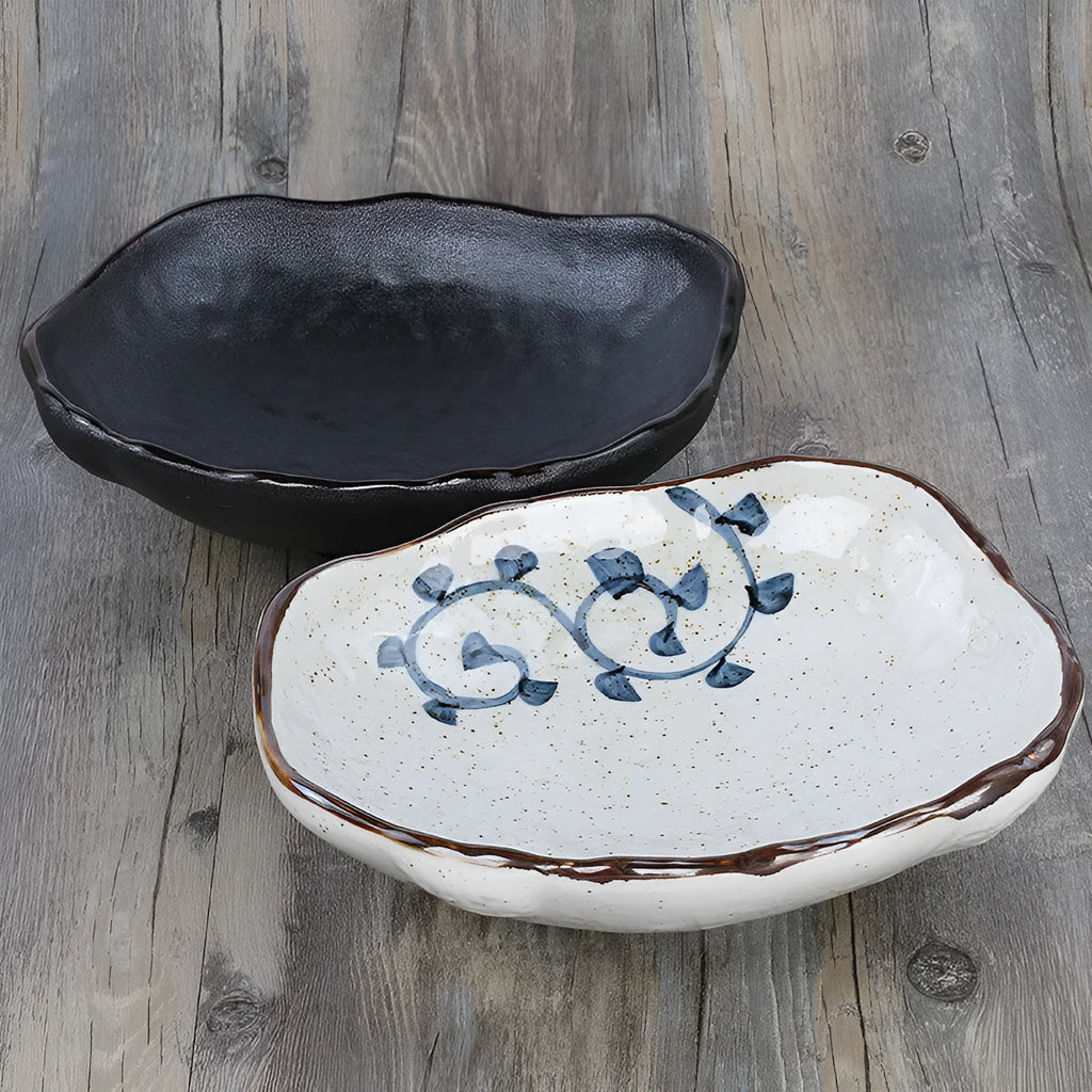 Japanese ceramic sashimi bowl with irregular shape and floral decorations