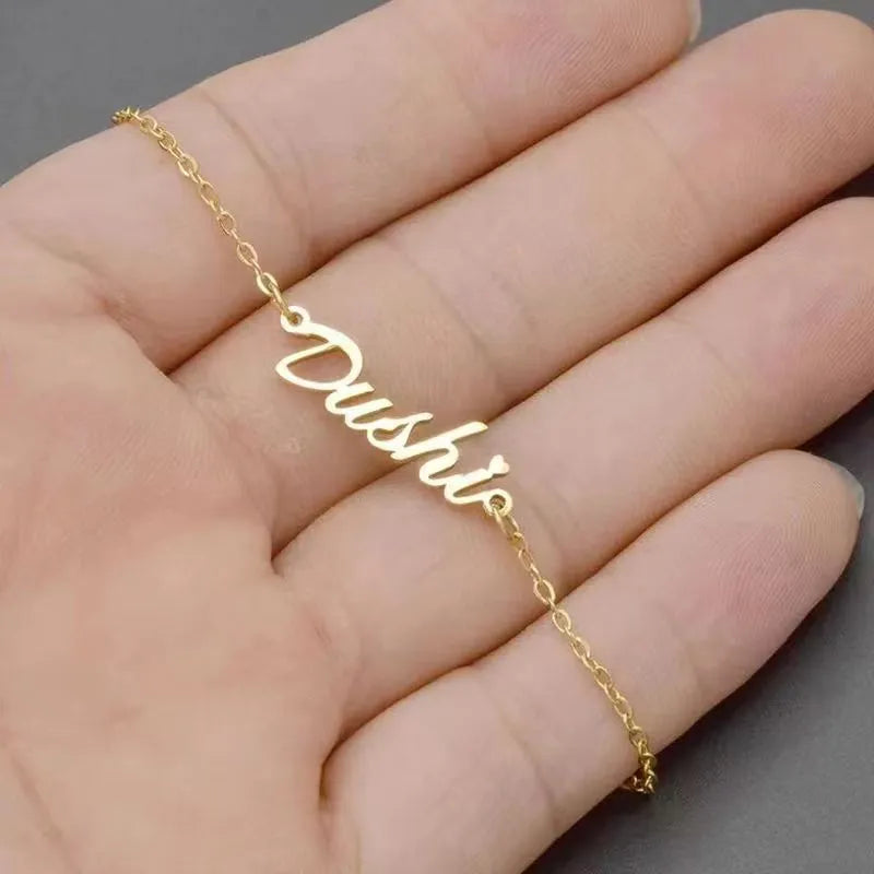 Titanium steel personalised cross chain bracelet with gold electroplated finish and custom letter name