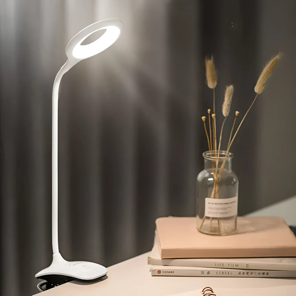 Green rechargeable touch table lamp with USB port on a wooden desk.