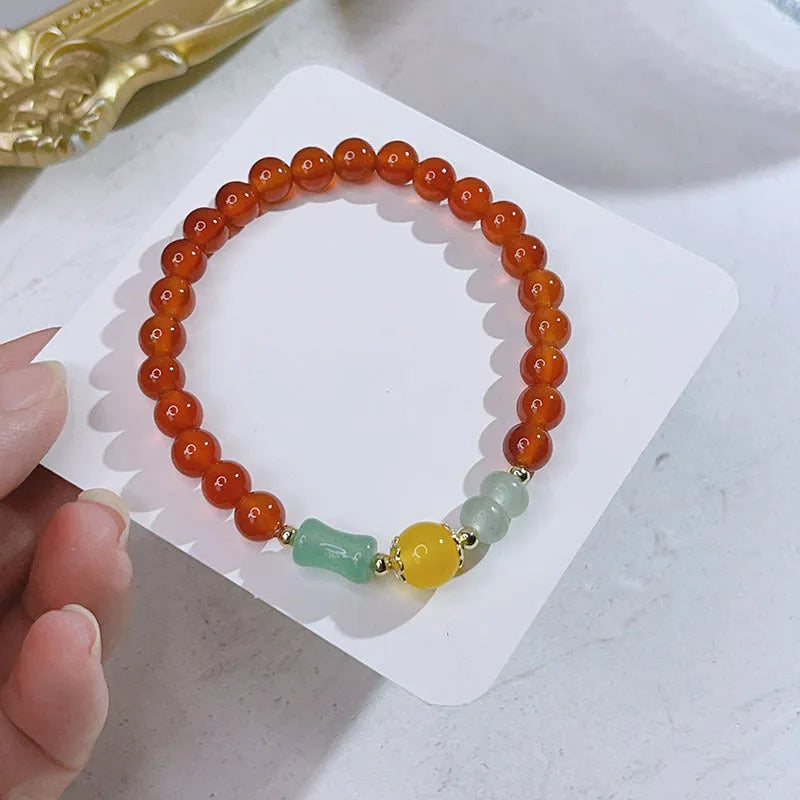 Red agate bracelet for women with Chinese style dragon motif, handmade from natural stone