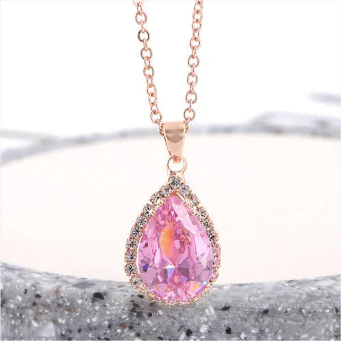 Women's rose gold drop shape necklace with rhinestone details on an alloy chain.