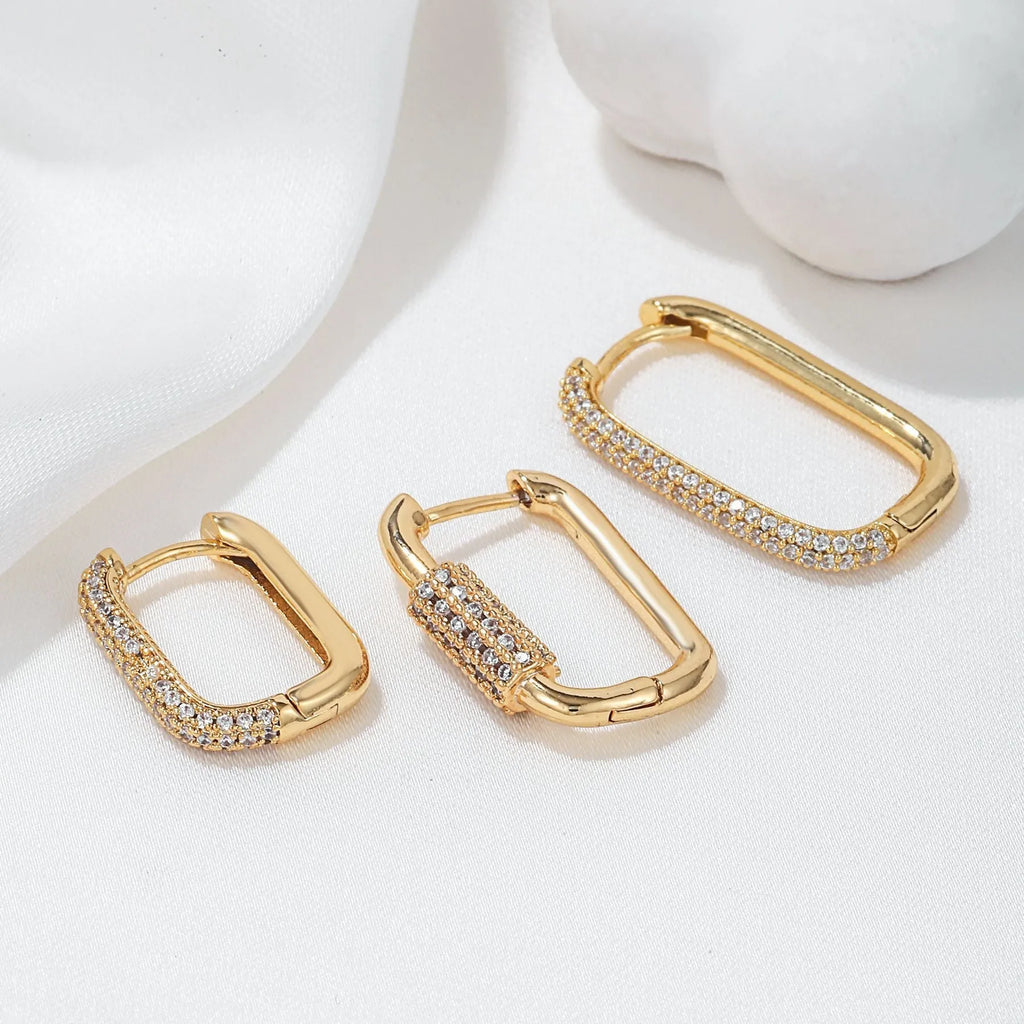 Three geometric earrings with micro inlaid zircon on square clips in gold and white finishes