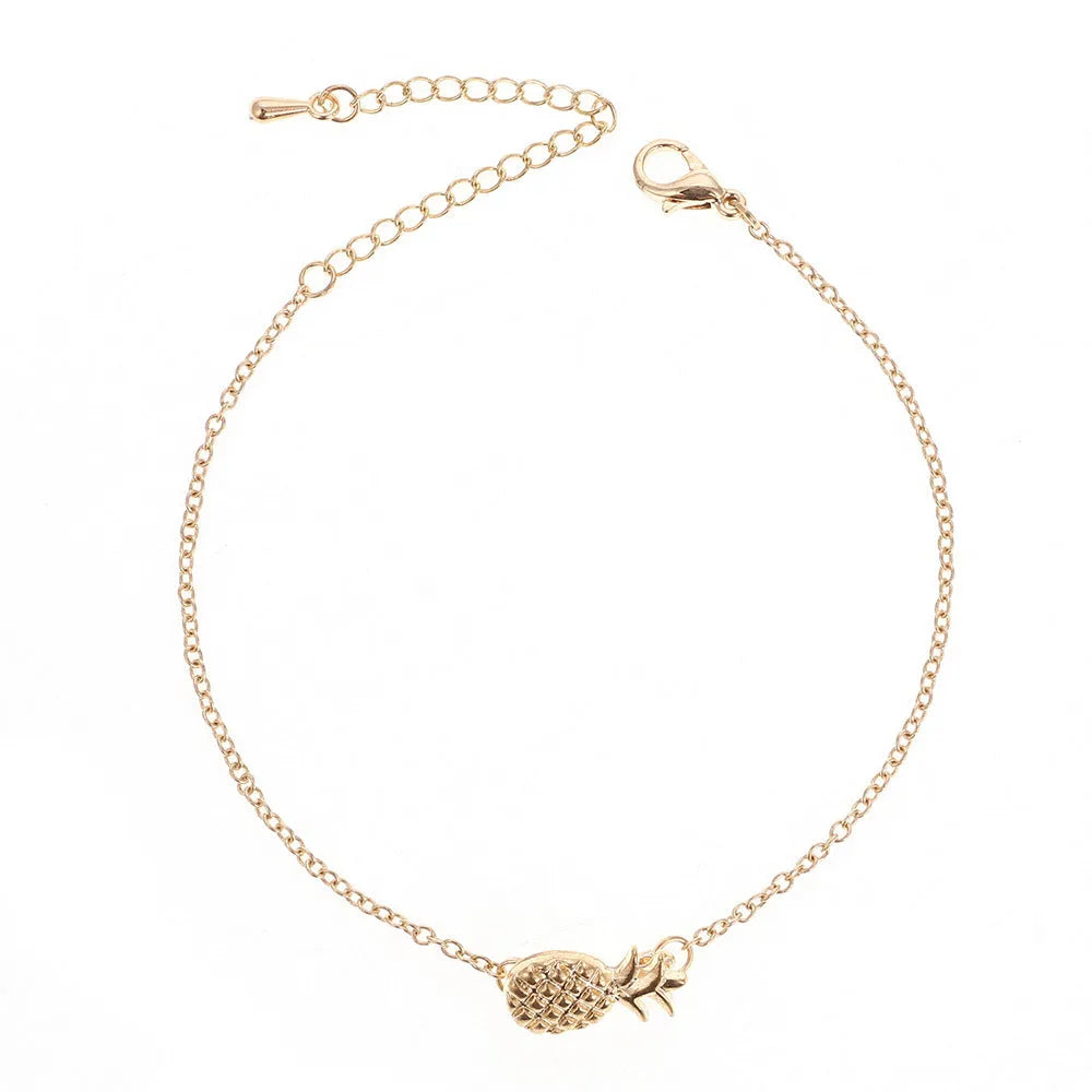 Gold and silver alloy pineapple charm bracelets on a white background.