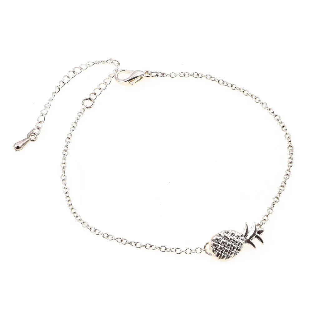 Gold and silver alloy pineapple charm bracelets on a white background.