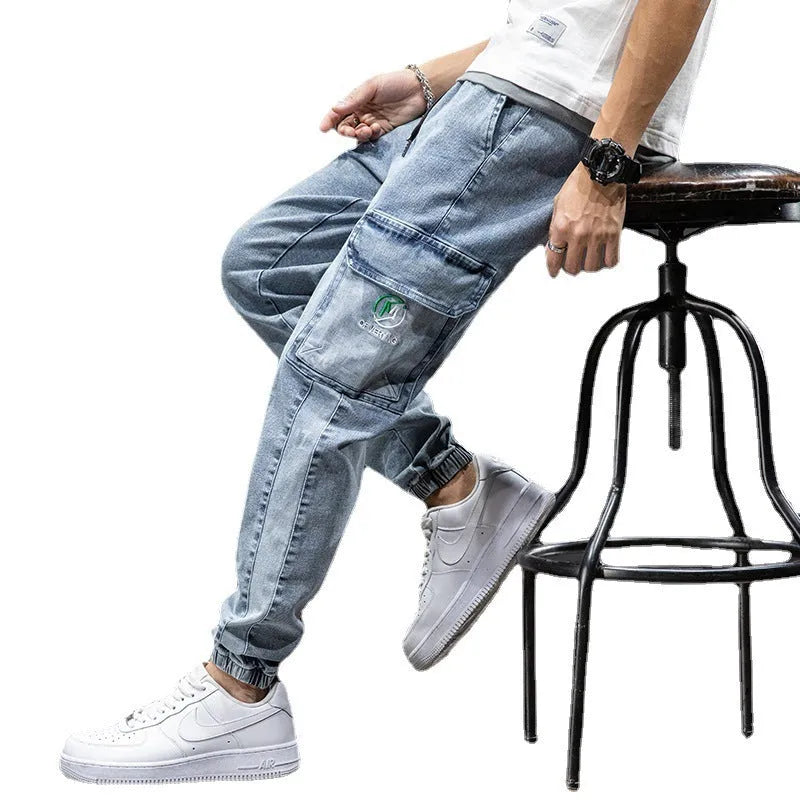 Man wearing loose fit straight leg cargo jeans in blue, showcasing the Korean style and micro-elastic cotton fabric.