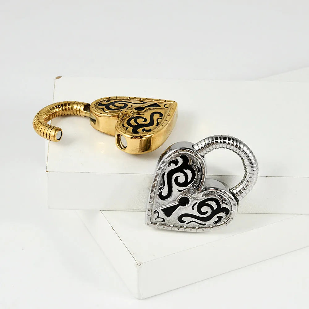 Heart-shaped stainless steel earring in steel colour close-up showing electroplated finish.