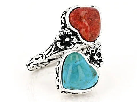 Antique silver electroplated alloy insect ring with turquoise stone on a white background