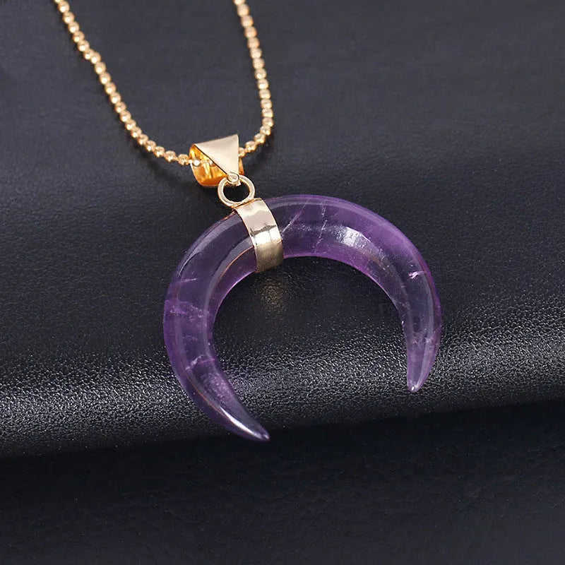 Close-up of a natural stone moon pendant necklace with electroplated copper chain.
