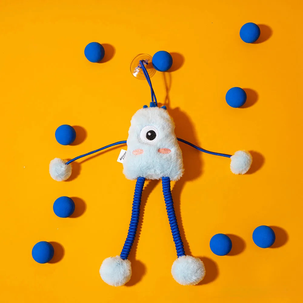 Blue plush cat toy with mint bell and elastic rope on floor