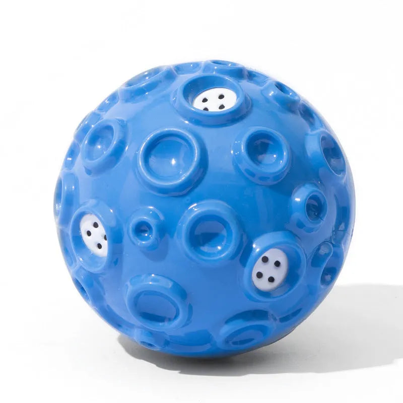 Colourful rubber dog chew ball with textured surface and squeaky sound mechanism