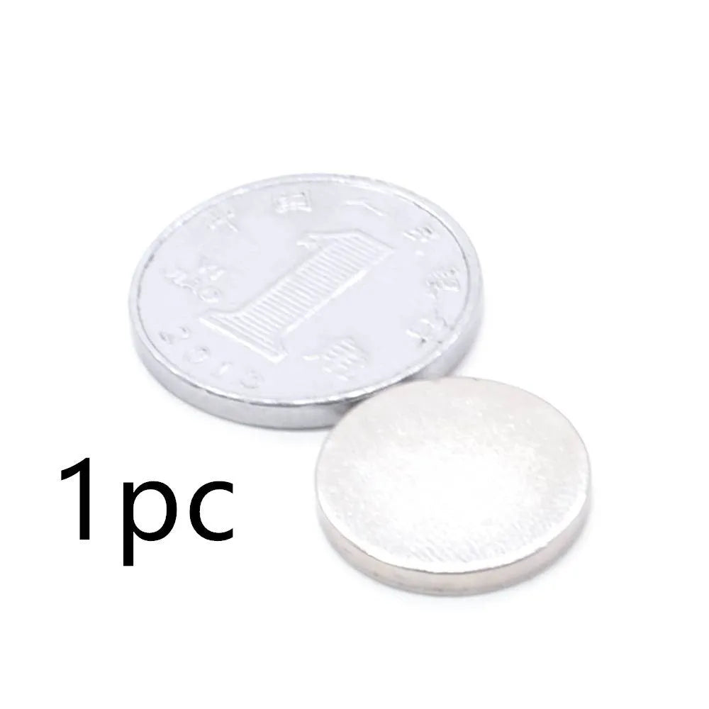 Silver NdFeB disc magnet 14mm diameter 2mm thickness on white background