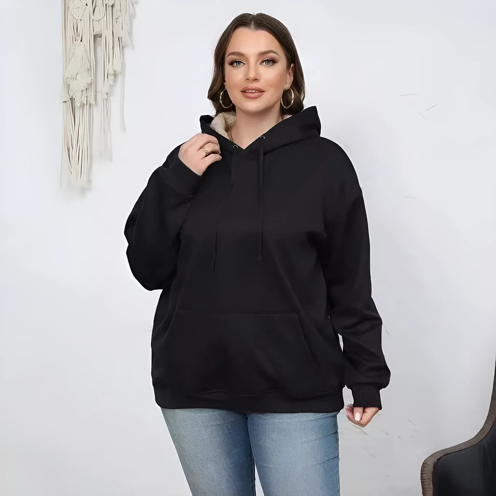 Women's loose-fit grey hooded sweater with a front pocket and a textured 3D pattern.
