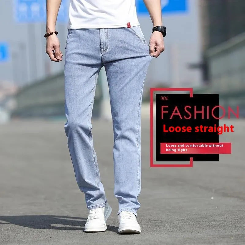 Men's smoky grey low waist straight leg jeans with a zipper fly, shown on a hanger.