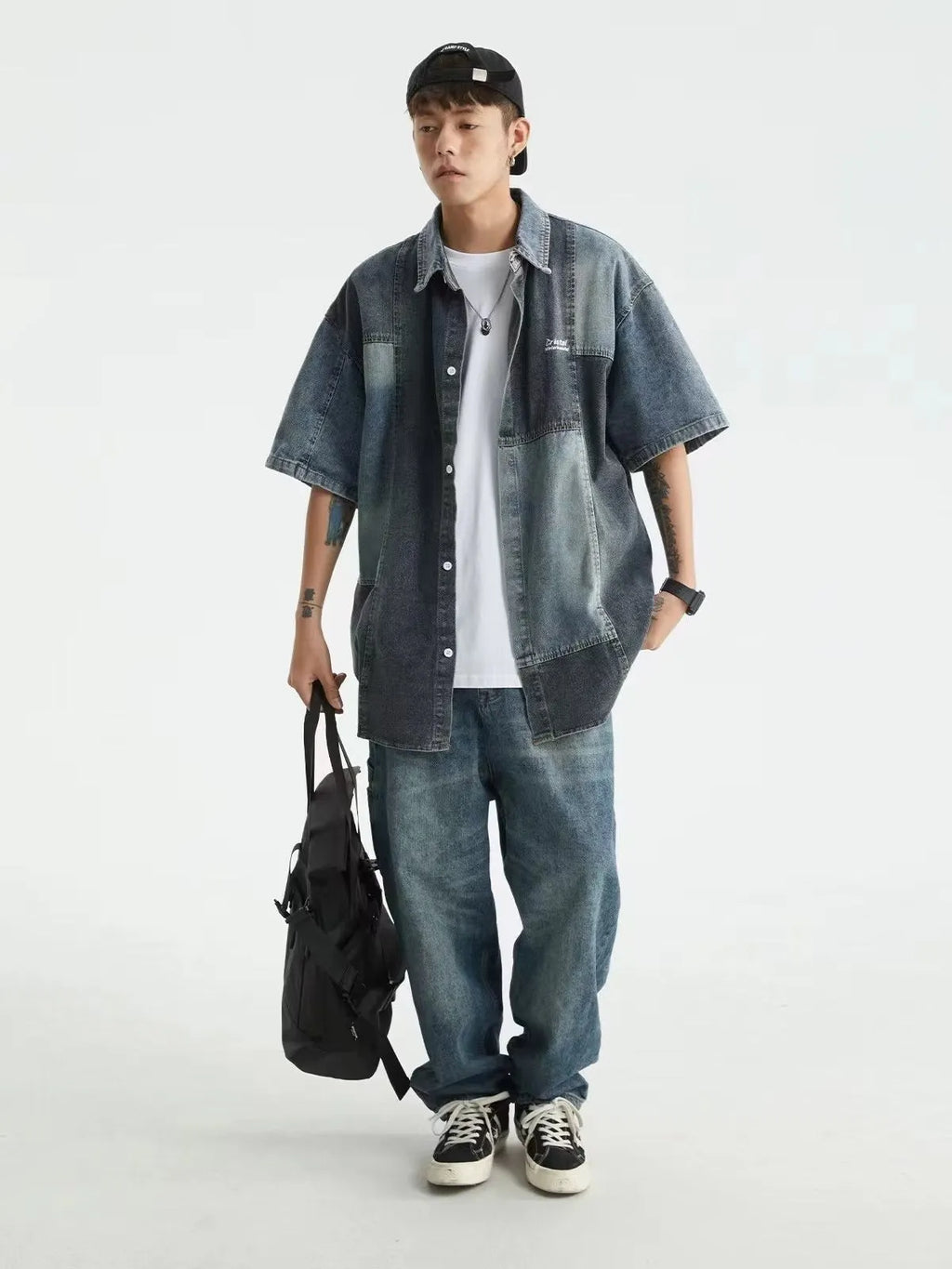 Blue Japanese-style loose fit denim shirt for men with washed stitching details.