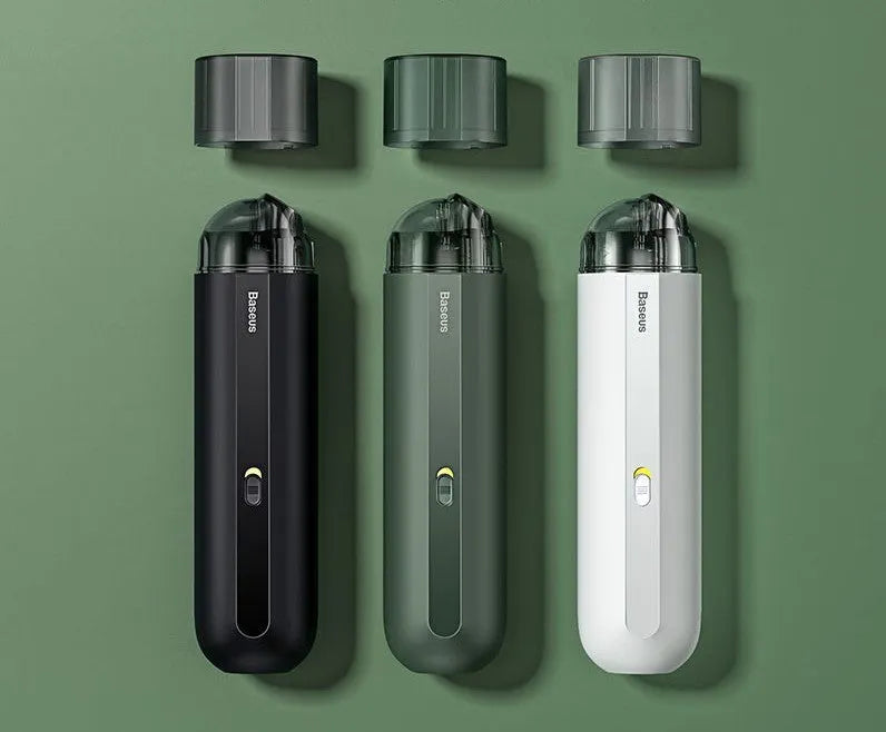 BASEUS wireless handheld car vacuum cleaner in black on a car seat, showing compact size and nozzle attachment.