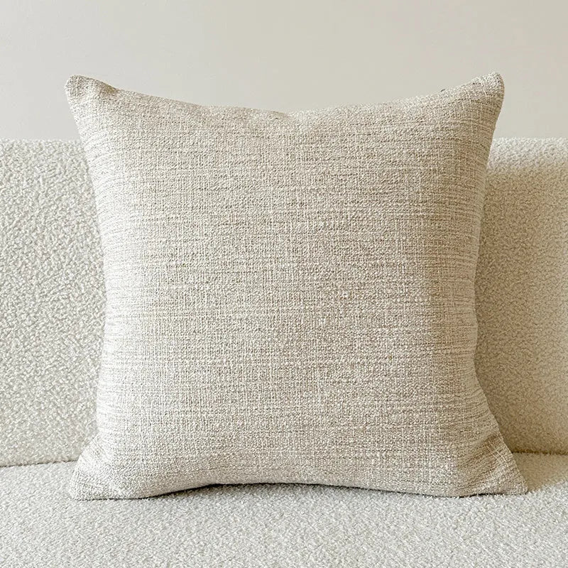 American-style amber jacquard pillow cover with paisley plant pattern, shown on a sofa.