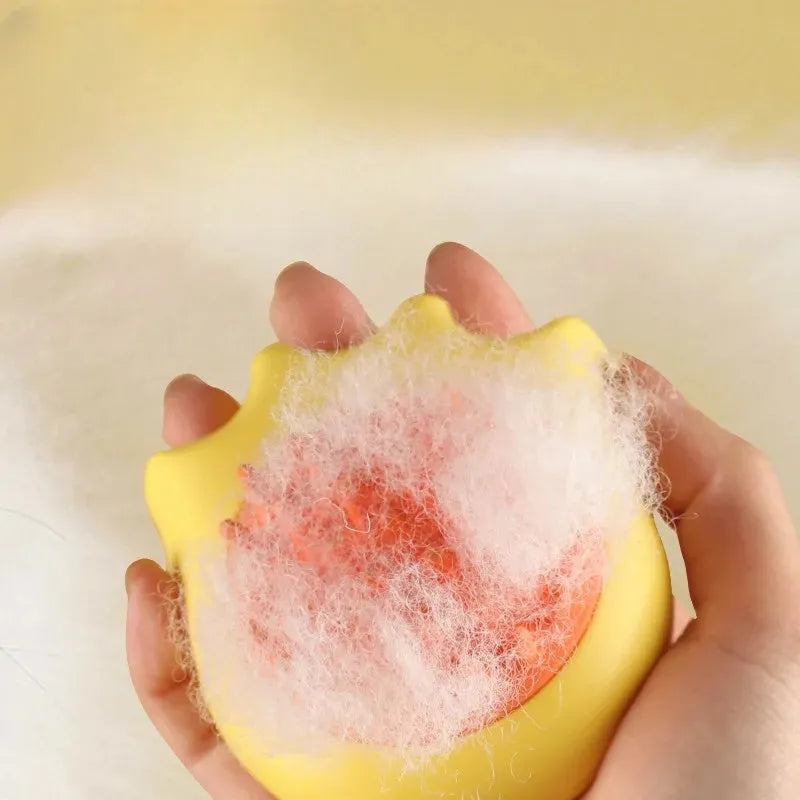 Blue pet bath brush with shampoo box for cat and dog washing, showing massage bristles and comb teeth