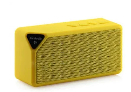 Cannon X3 small cube-shaped wireless Bluetooth speaker in black, blue, green, red, or yellow colour.