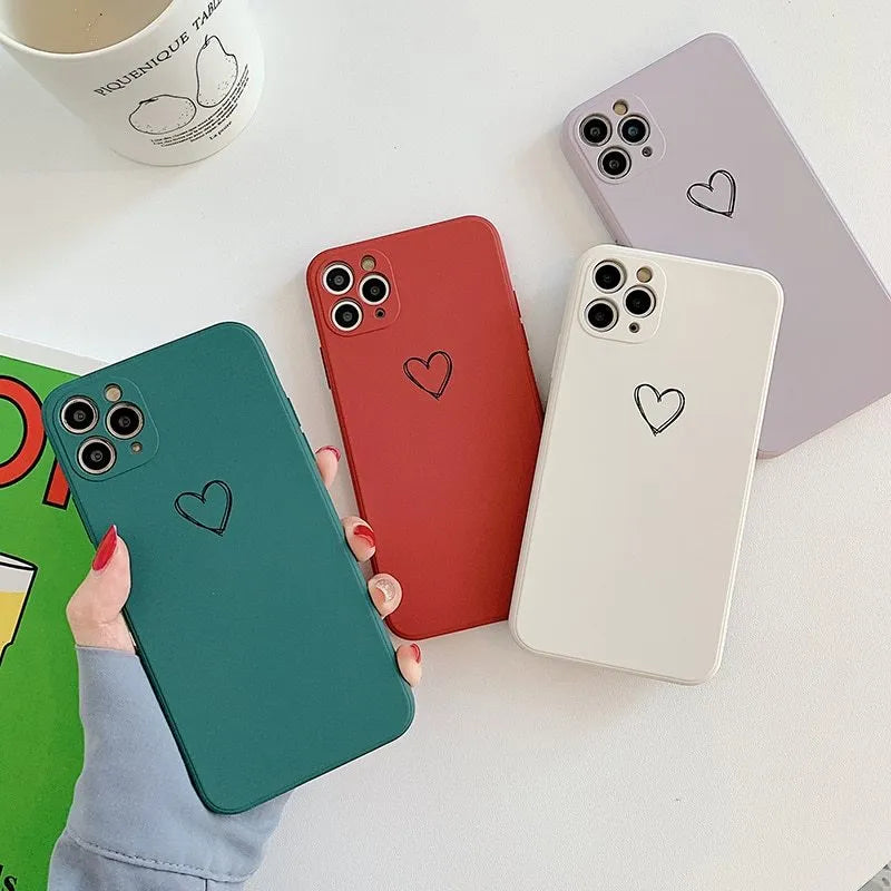 Solid colour silicone TPU back cover case for Apple iPhone on a table.