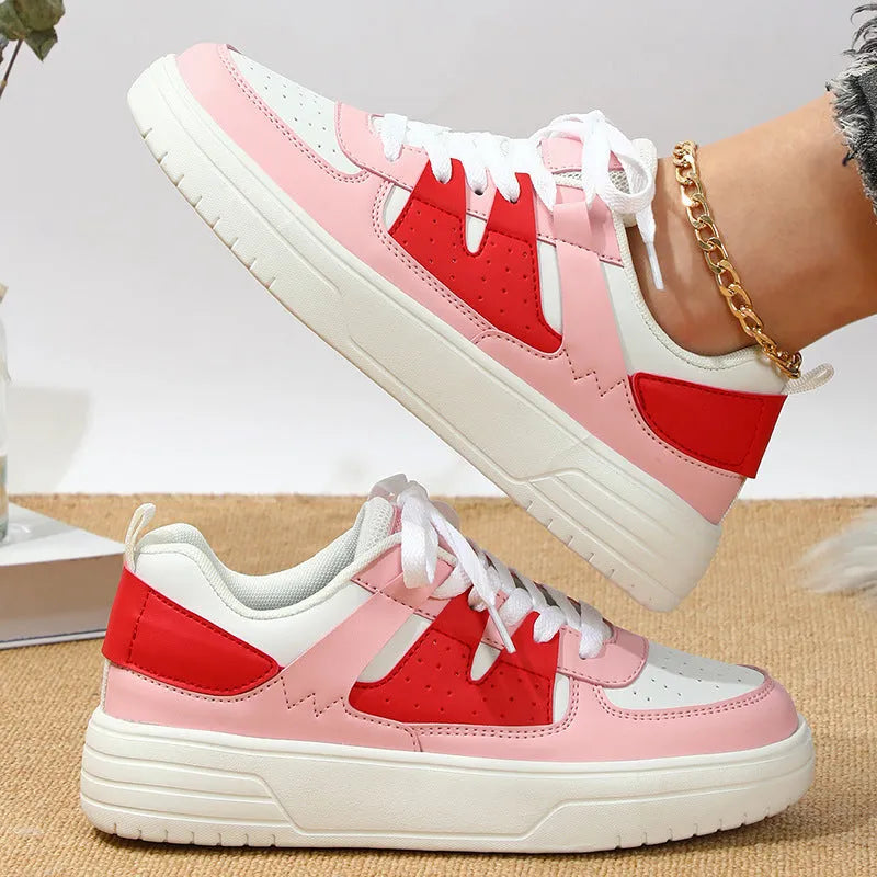 Casual solid colour low top sports shoes with front lace-up, round toe, and metal accents on a white background