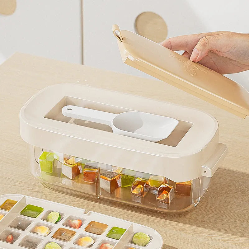 High capacity plastic ice cube tray with grid and removable ice shovel stored in its slot.