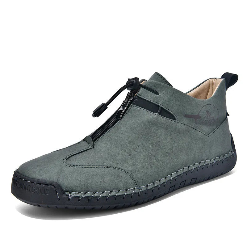 Men's black casual leather shoes with a round toe and mid-height rubber sole.