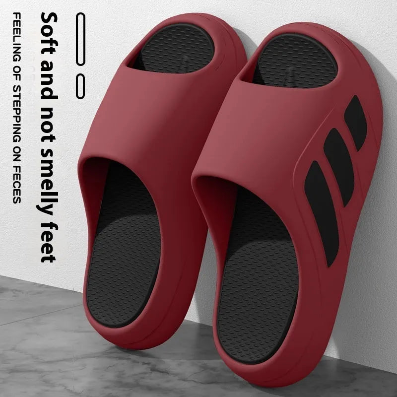 Men's EVA flip flops with letter print, brown colour, on a wooden floor