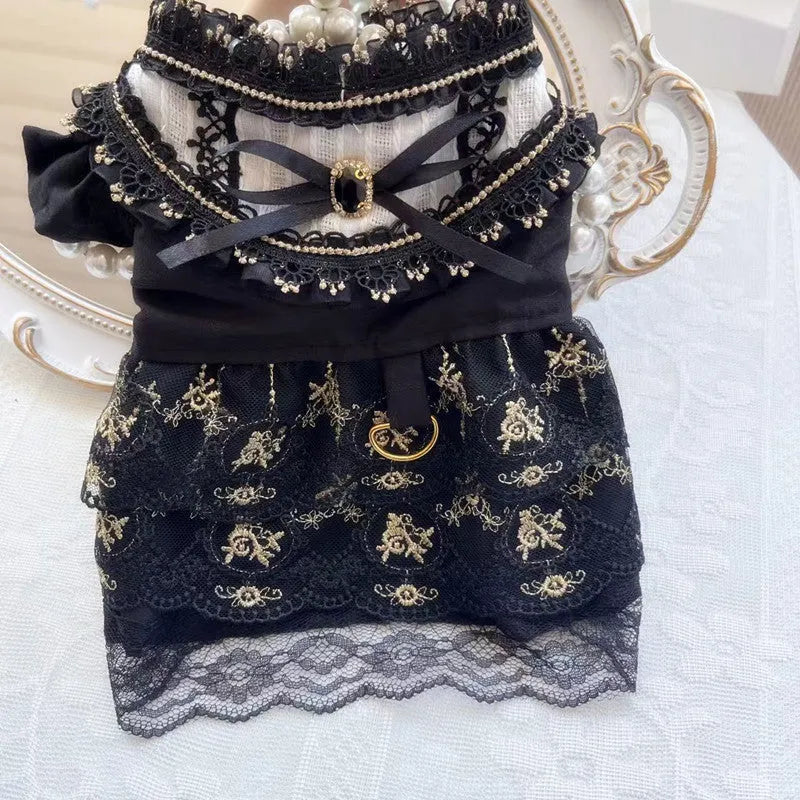 Gold Gothic princess style dress for a small dog or cat on a hanger