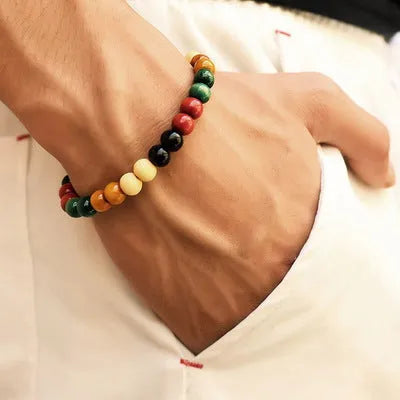 Natural stone bead bracelet with lava stones on a wrist, showing ethnic style and unisex design.