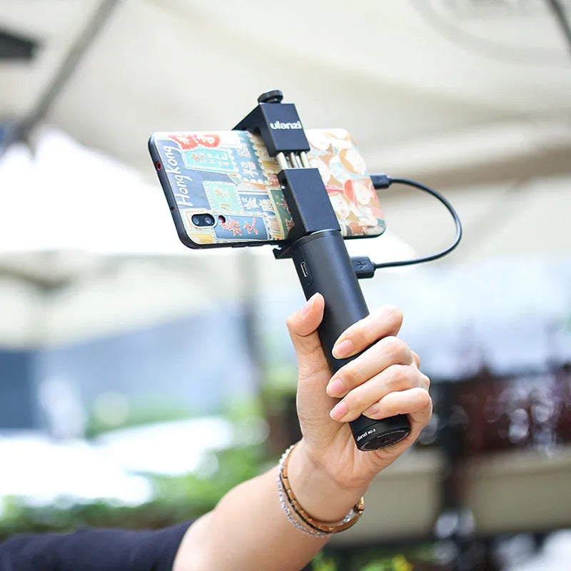 Black aluminium alloy charging treasure handle power bank measuring 12.5cm with 6800mAh capacity