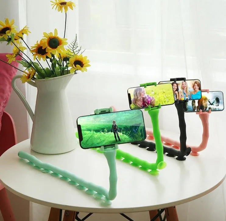 Flexible black phone holder with bendable arm and suction cup mount showing 360-degree rotation