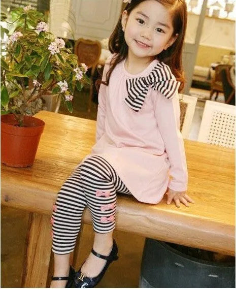 Girl's pink cotton clothing set with long sleeve top and trousers in children's sizes