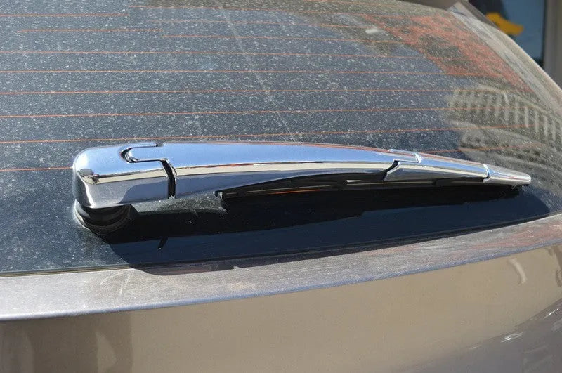 Set of four silvery ABS plastic rear window wiper cover strips for a 2010 Hyundai.